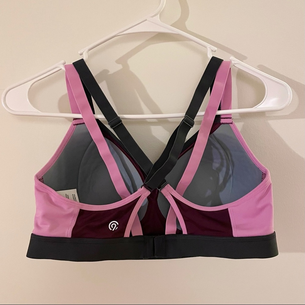 Strappy pink and purple sports bra